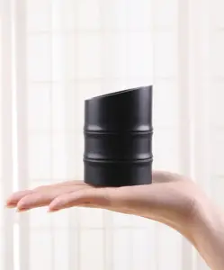 AINOCHI ebony wood makeup brush holder displayed on an open hand, showing product size and craftsmanship.