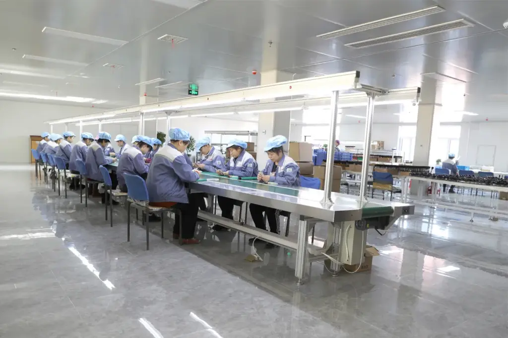Dedicated team for precise assembly of makeup brushes inside a spacious clean factory.