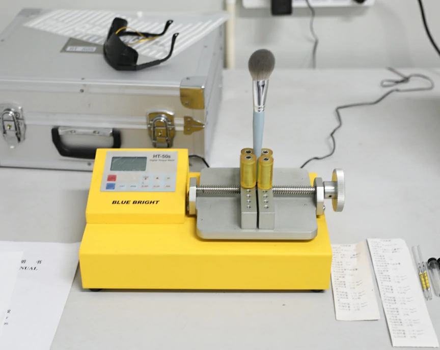 Connector pull-out prevention tester to assess the durability of brush connections.