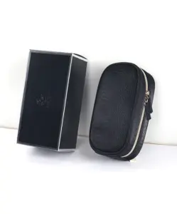 AINOCHI black leather makeup brush bag and box displayed side by side on a white background.