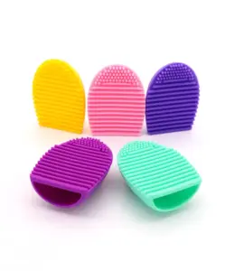 “Set of colorful silicone multi-use wash brush eggs for cleaning makeup brushes and sponges, featuring practical textured surfaces.