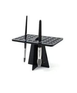 Black makeup brush cleaning drying rack with multiple slots for air drying beauty brushes.
