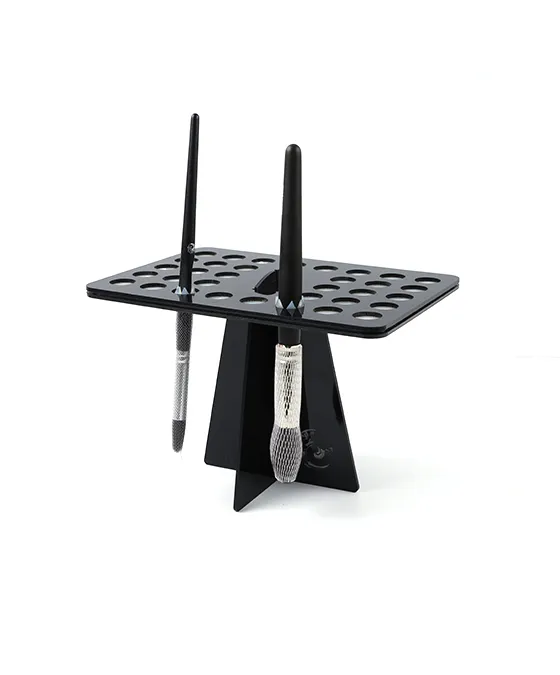 Black makeup brush cleaning drying rack with multiple slots for air drying beauty brushes.