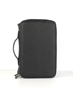 Front view of the AINOCHI makeup brush organizer case in black leather, designed for professional and travel use.