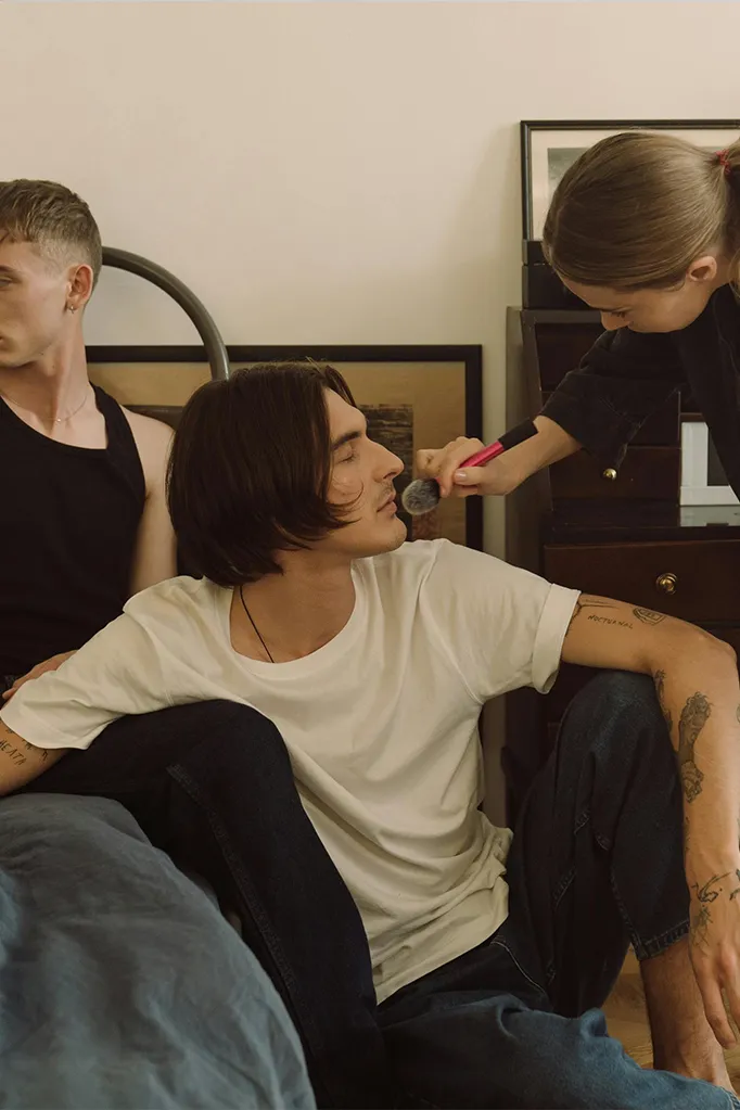 Professional makeup artists using premium makeup brushes for flawless application.