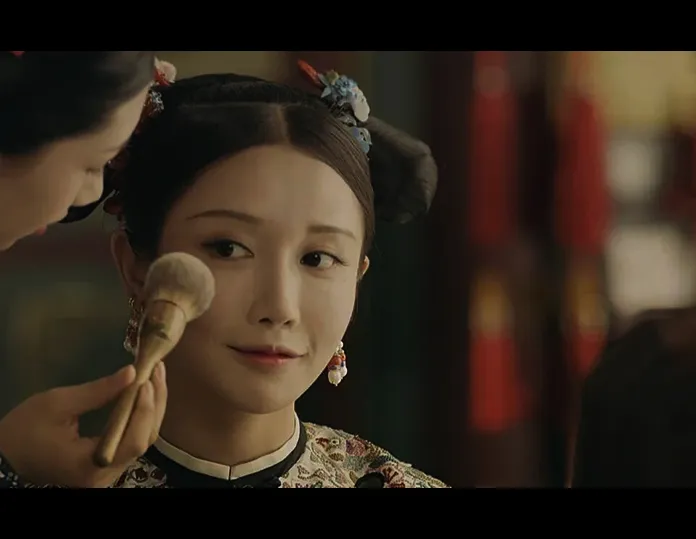 Ancient Chinese-style makeup application with a brush, illustrating early beauty rituals.