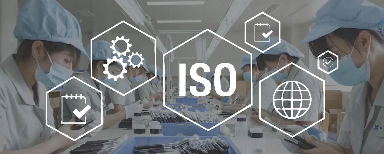Workers on a clean makeup brush factory production line with ISO and quality icons overlayed, showing standards and certification focus