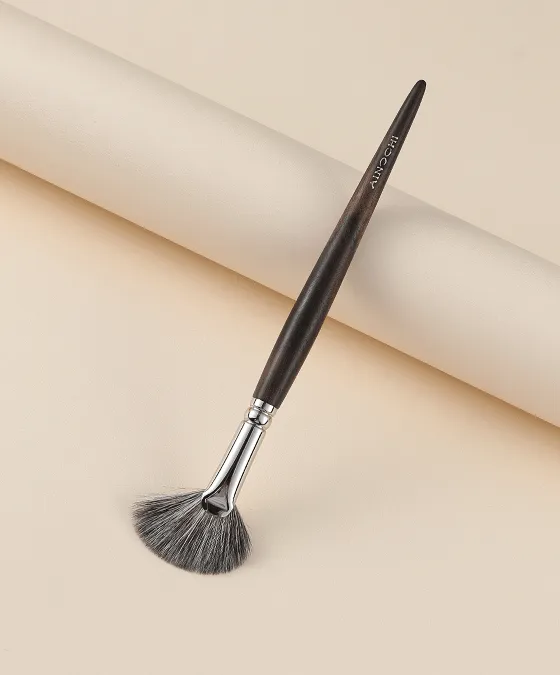 Ainochi S6412 angled fan highlighter brush full view on beige background, blue squirrel fan highlighter brush for cheekbone glow and contour blending